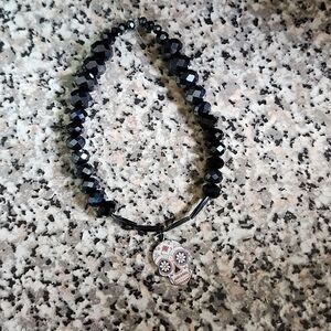 Handmade lava beads and faceted bead skull Nocturnal Sentinel bracelet